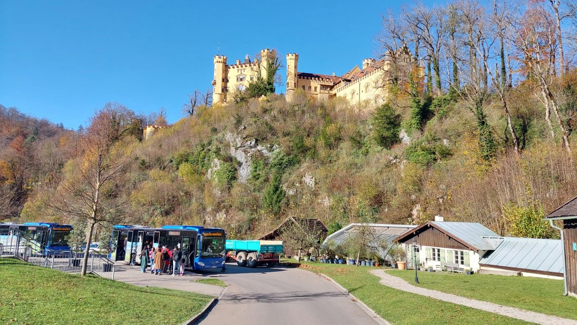 bus-starting-point-neuschwanstein-castle-hohenschwangau-bavaria-germany bus starting point under hohenschwangau castle to neuschwanstein castle autumn sunny day, bavaria-germany