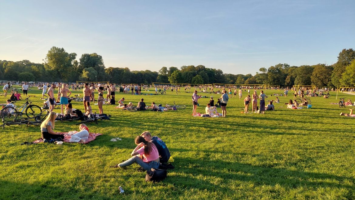 english-garden-sport-summer-munich-bavaria-germany people picnicking playing sports english garden munich bavaria germany summer sunny day