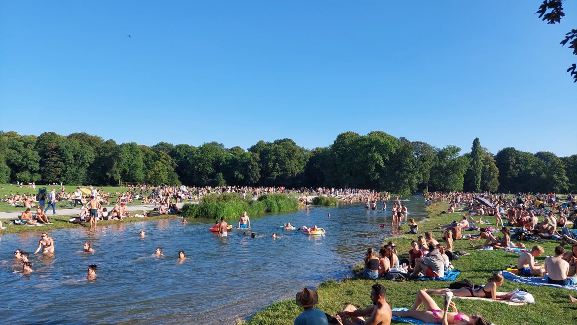 english-garden-swimming-summer-munich-bavaria-germany people swimming english garden munich bavaria germany summer river sunny day