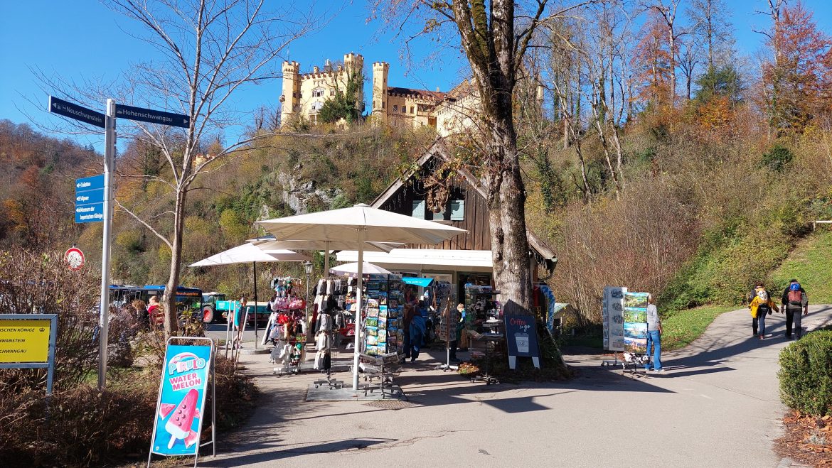 info-sign-hohenschwangau-castle-neuschwanstein-castle-bavaria-germany info signs with directions to hohenschwangau and neuschwanstein castles autumn hohenschwangau, bavaria-germany
