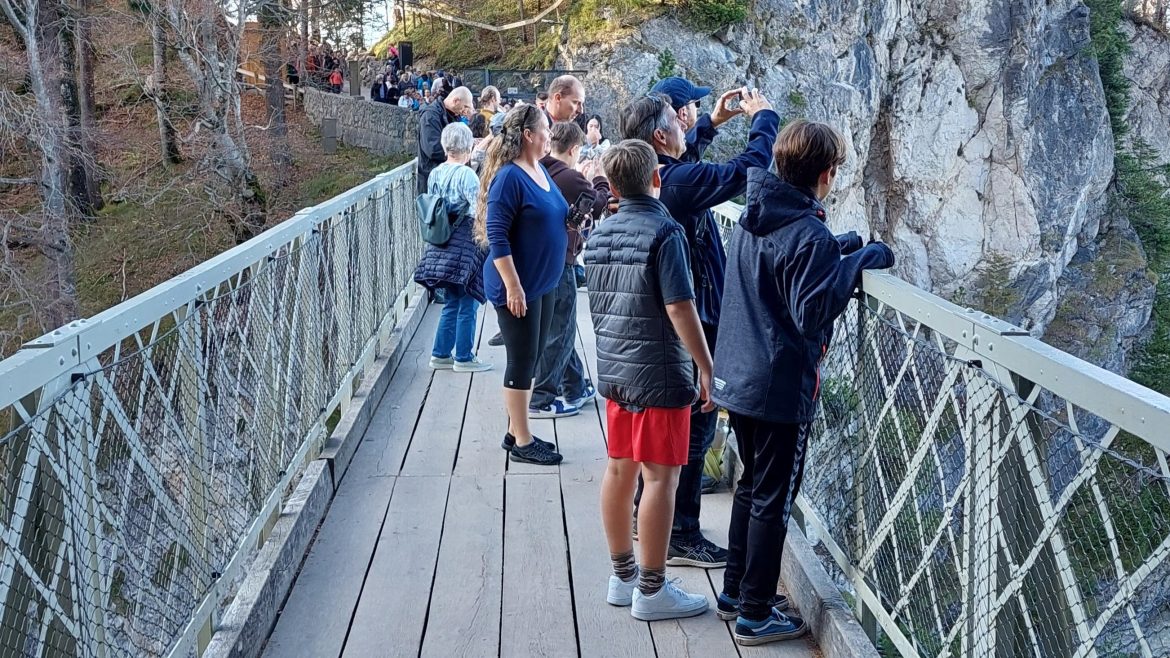 marien-bridge-neuschwanstein-castle-bavaria-germany marien bridge crowded with people near neuschwanstein castle, bavaria-germany