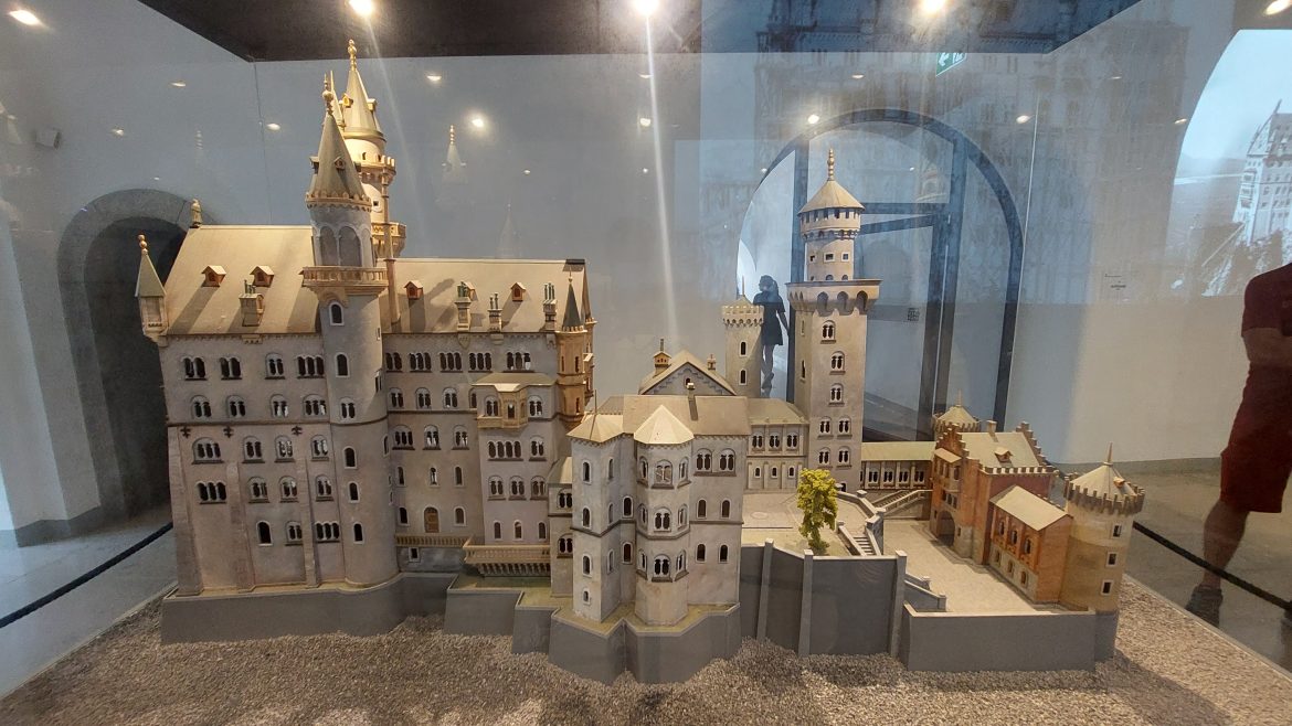 neuschwanstein-castle-model-bavaria-germany model of neuschwanstein castle behind glass display, bavaria-germany