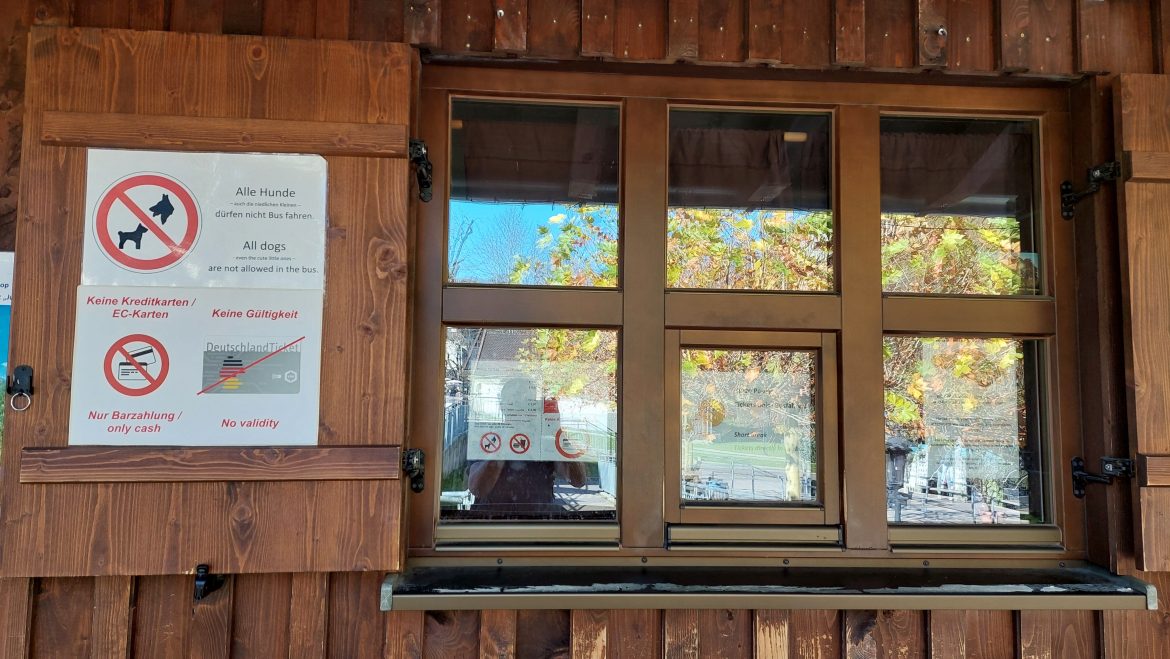 ticket-office-window-bus-neuschwanstein-castle-hohenschwangau-bavaria-germany bus ticket office window hohenschwangau to neuschwanstein castle cash only no dogs no deutschland ticket, bavaria-germany