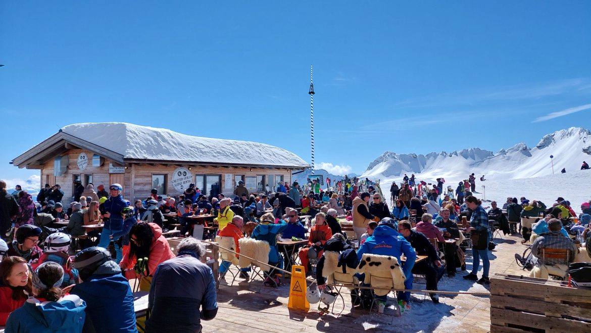 sonnalpin-zugspitze-bavaria-germany People dining on Sonnalpin terrace under Zugspitze on a sunny March day, Bavaria, Germany
